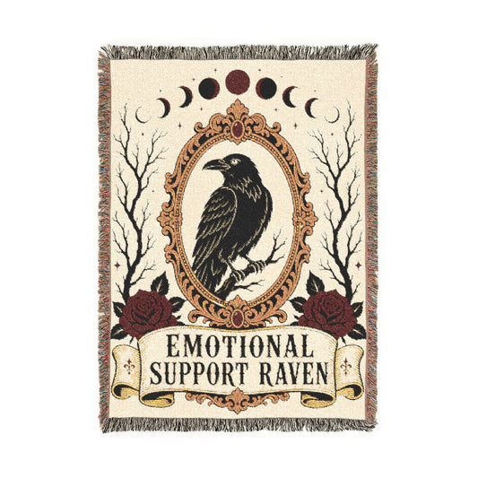 Raven woven blanket spread across a bed as moody gothic bedding
