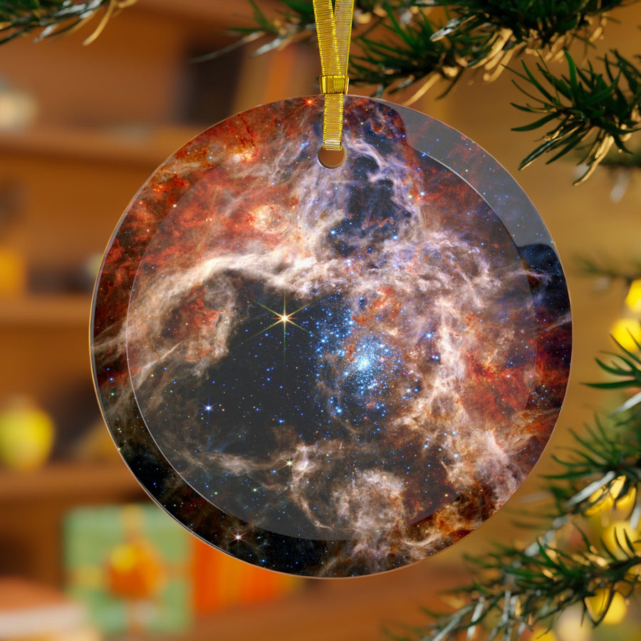 James Webb Tarantula Nebula glass Christmas ornament hanging on a Christmas tree