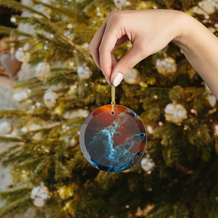 James Webb Pillars of Creation glass Christmas ornament held in hand