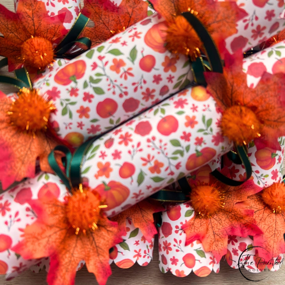 Decorated fall and thanksgiving themed crackers with snaps and decorated with leaves, ribbons and bells perfect thanksgiving dinner favor or dinner party gift