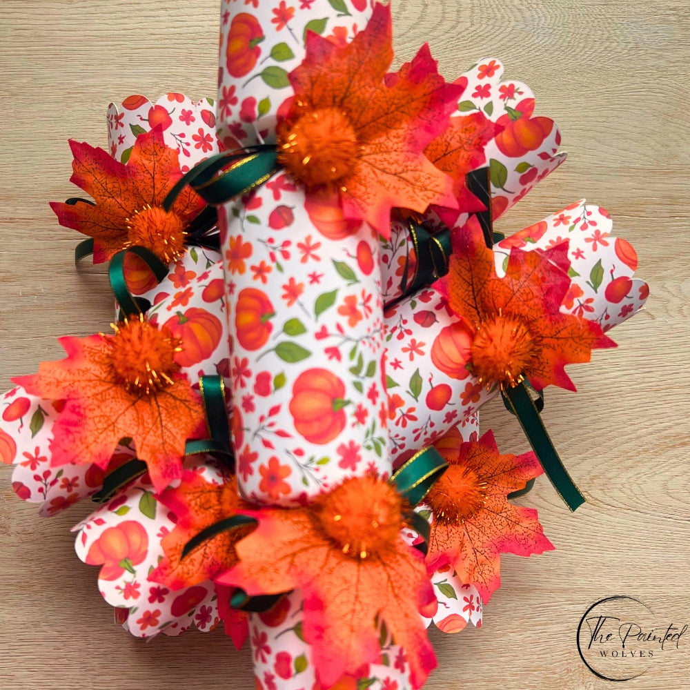Decorated fall and thanksgiving themed crackers with snaps and decorated with leaves, ribbons and bells perfect thanksgiving dinner favor or dinner party gift