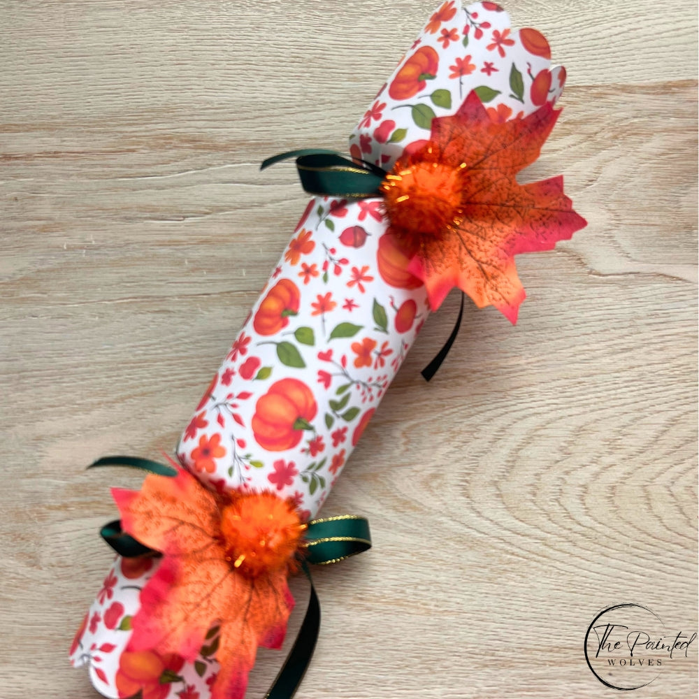 Decorated fall and thanksgiving themed crackers with snaps and decorated with leaves, ribbons and bells perfect thanksgiving dinner favor or dinner party gift