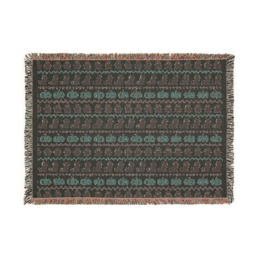 Reverse side of the Haunted Heirloom woven blanket in muted tones