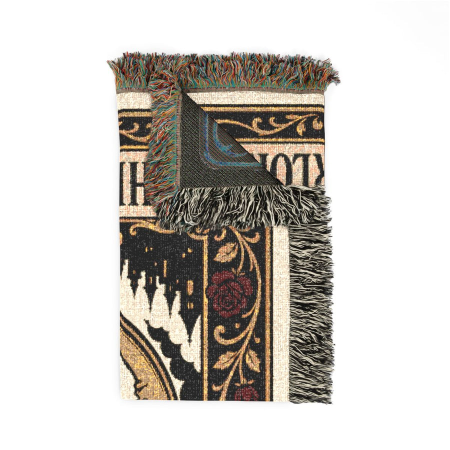 The Overlord woven blanket folded with one corner turned back to show the reverse side