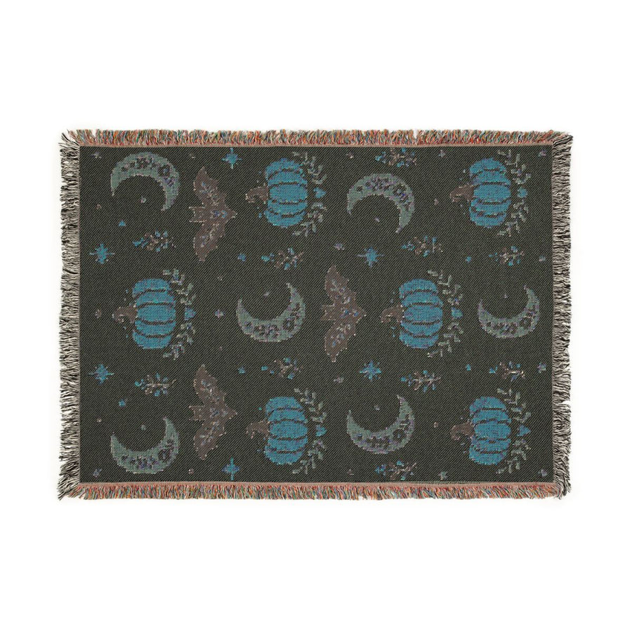 Back of the Subtle Spooky neutral Halloween woven blanket showing the reverse side of the weave