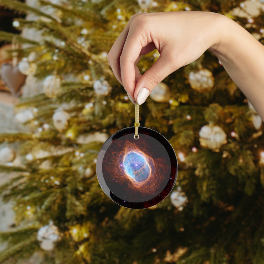 James Webb Southern Ring Nebula glass Christmas ornament held in hand