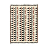 Beige Halloween Fair Isle blanket on a bed for subtle autumn decor