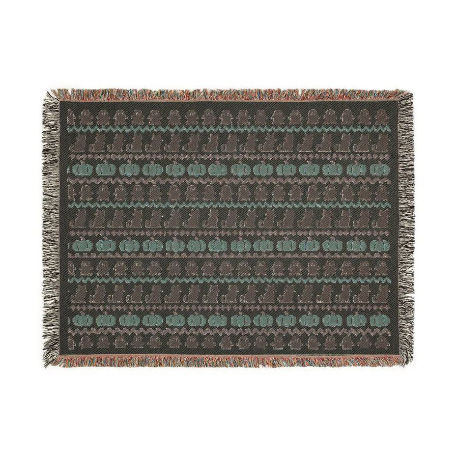 Neutral Halloween Fair Isle blanket styled with autumn decor