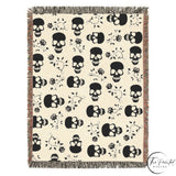 Close view of the black skull and roses woven blanket weave and rose detail