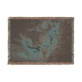 Folded Tarantula Nebula woven blanket showing the reverse of the jacquard weave