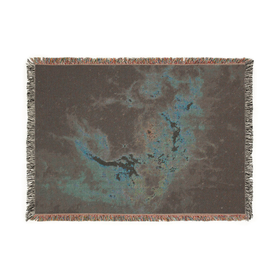Folded Tarantula Nebula woven blanket showing the reverse of the jacquard weave