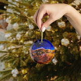 James Webb Carina Nebula Cosmic Cliffs glass Christmas ornament held in hand
