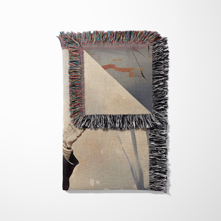 Folded pink skeleton couple woven blanket showing the cotton jacquard reverse