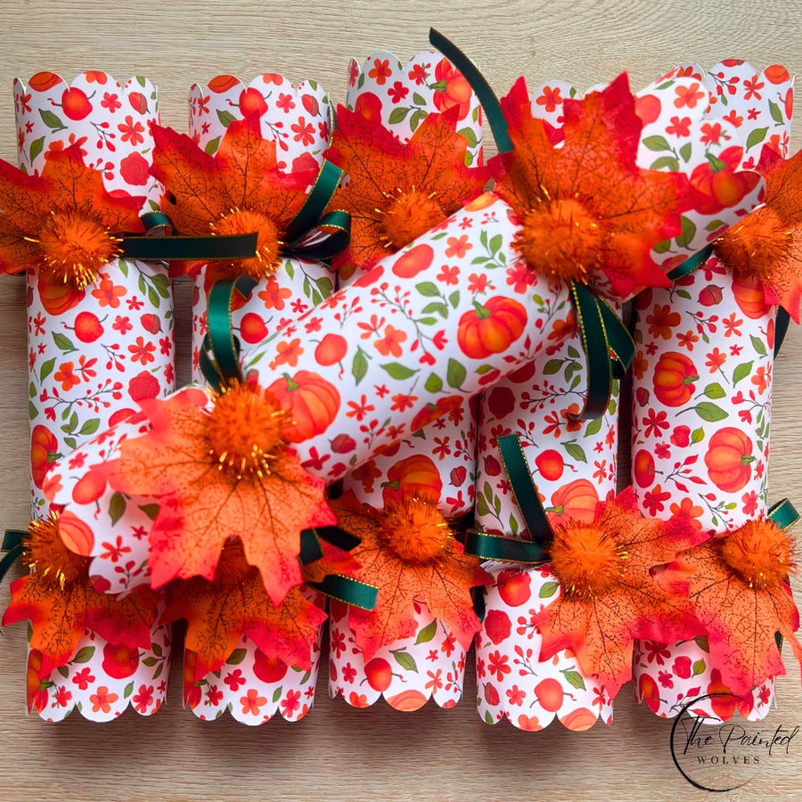 Thanksgiving crackers in orange pumpkin tones, handmade dinner party favours in a row
