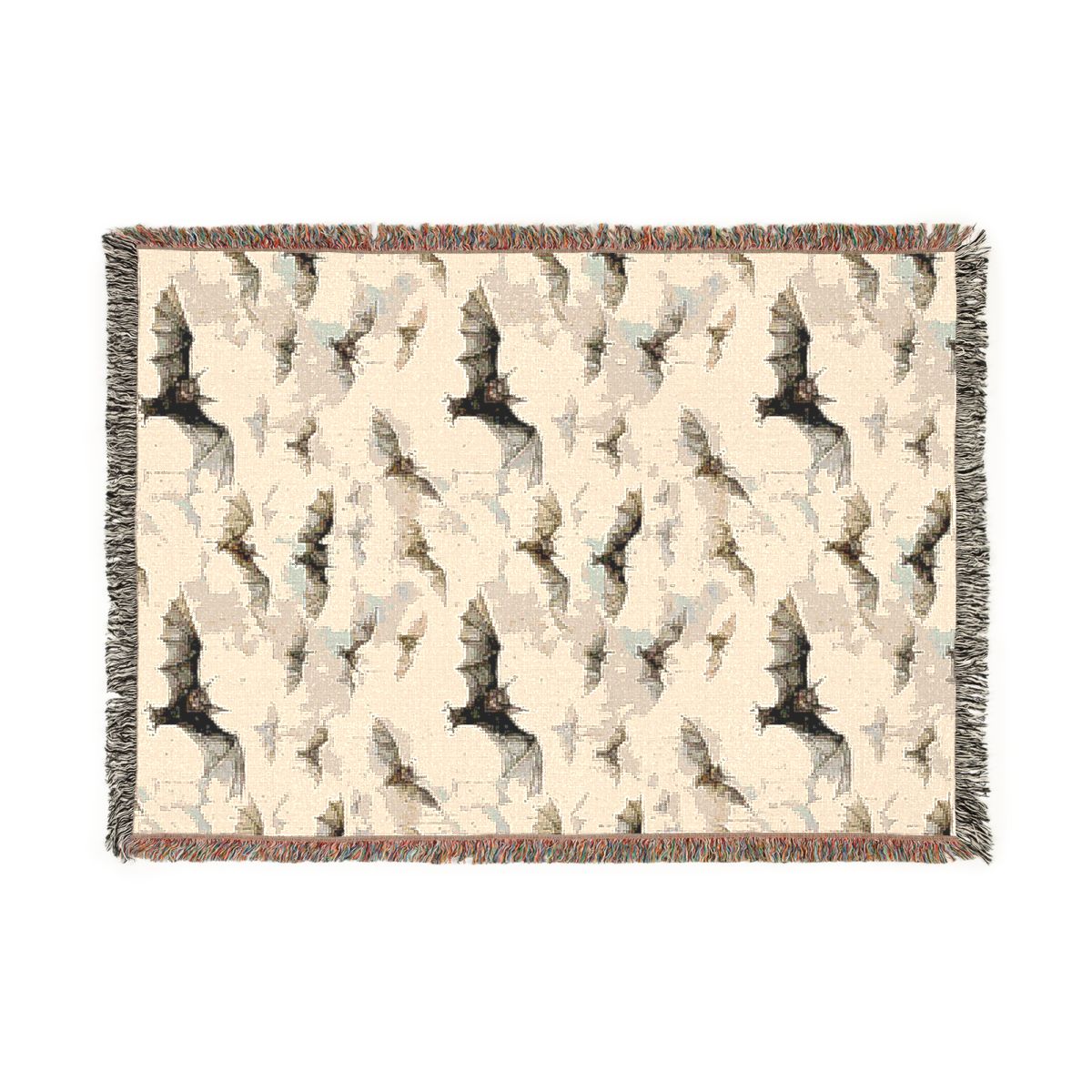 Bat woven blanket laid flat, cream cotton jacquard with a pattern of black bats and fringed edges