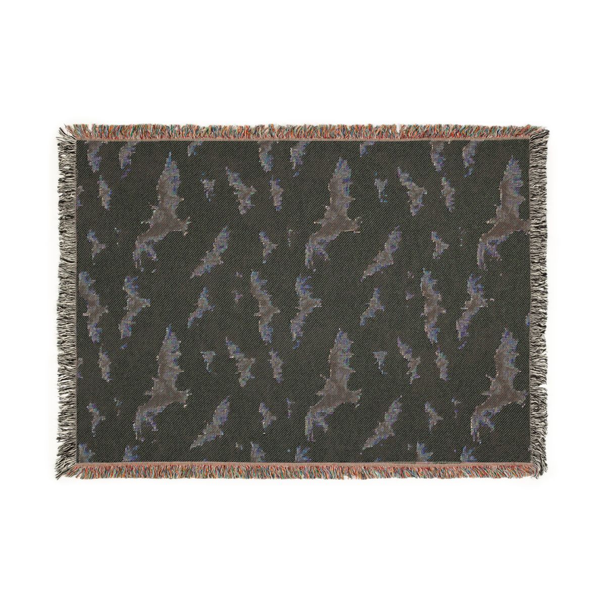 Reverse side of the bat woven blanket in dark charcoal with the bat pattern