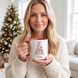 Woman holding coquette bow Christmas tree mug by the tree