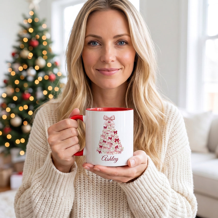 Woman holding coquette bow Christmas tree mug by the tree