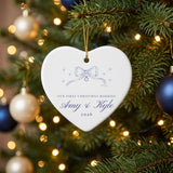 Our First Christmas Married personalized ceramic heart ornament with bow, names and year, hanging on a Christmas tree