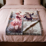 Pink skeleton couple woven blanket folded on a bed with the reverse side showing