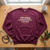 Maroon ICU nurse Christmas sweatshirt laid flat with a stethoscope, candy canes and holly