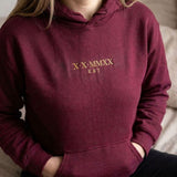 Maroon Roman numeral hoodie with X X MMXX and K & T embroidered in old gold thread