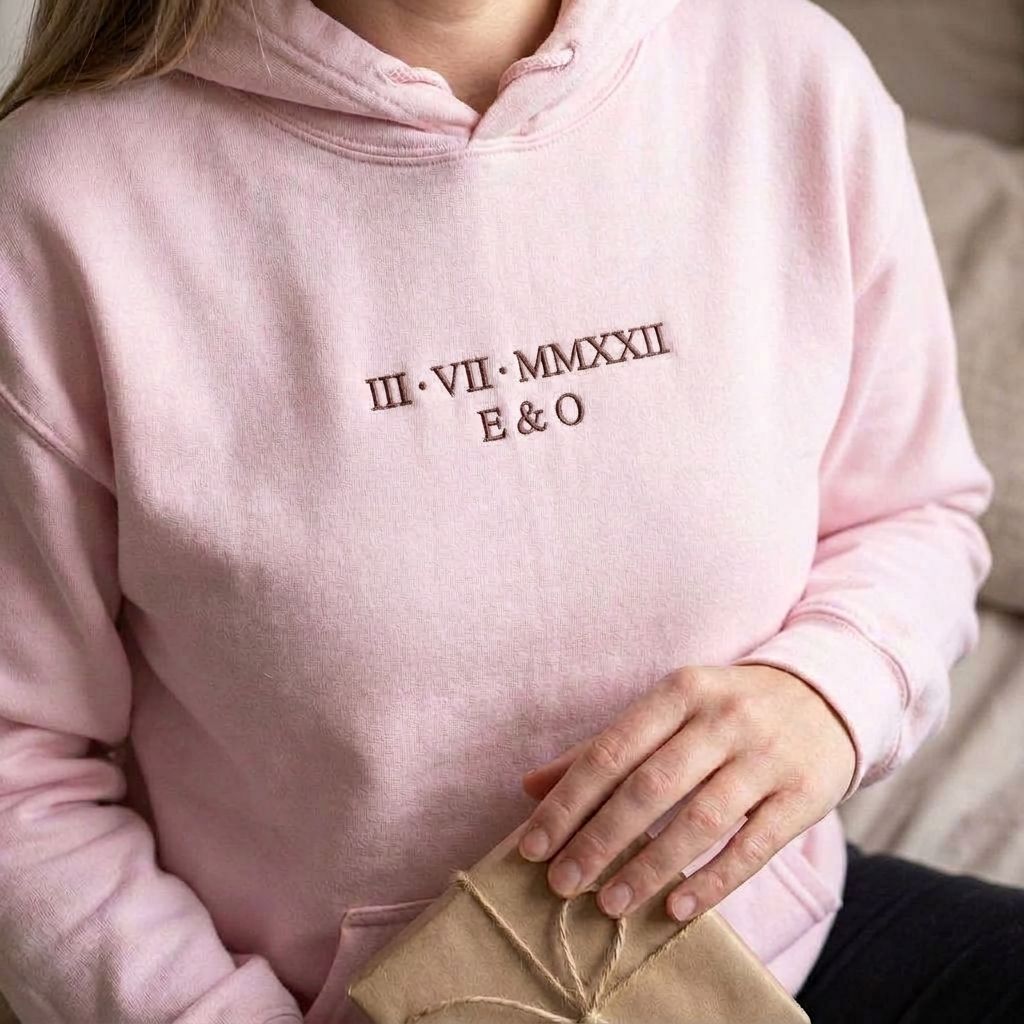 Light pink Roman numeral hoodie with III VII MMXXII and E & O embroidered in brown thread