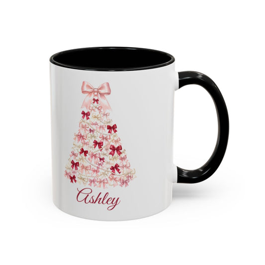 Coquette bow Christmas tree mug, white ceramic with a black handle, pink bow tree and the name Ashley