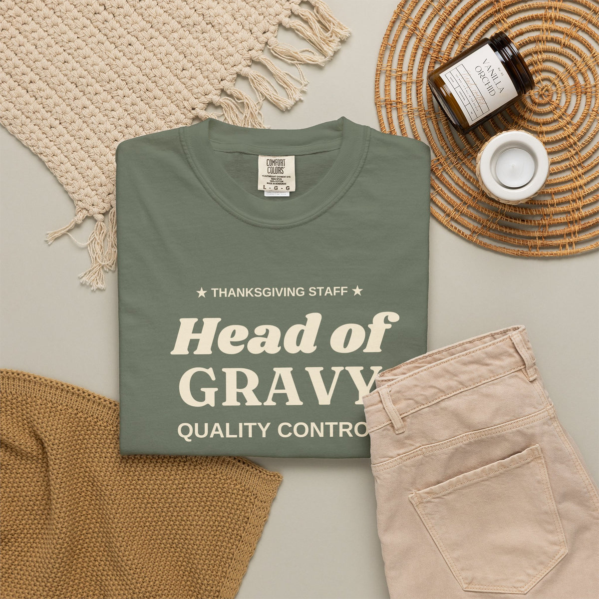 Head of Gravy Quality Control tee in Moss, folded flat lay with fall table props