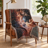 Nebula woven throw draped over a leather armchair in a bright reading nook