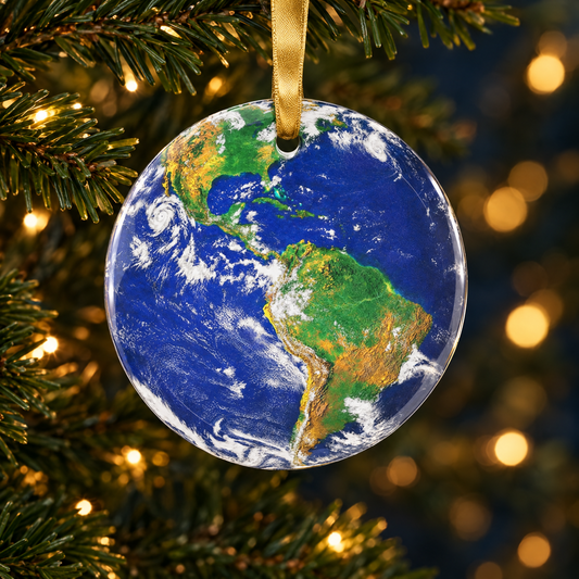 Earth glass Christmas ornament hanging on a Christmas tree