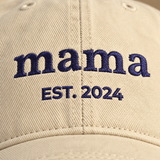 Close up of navy embroidery stitching on the mama hat