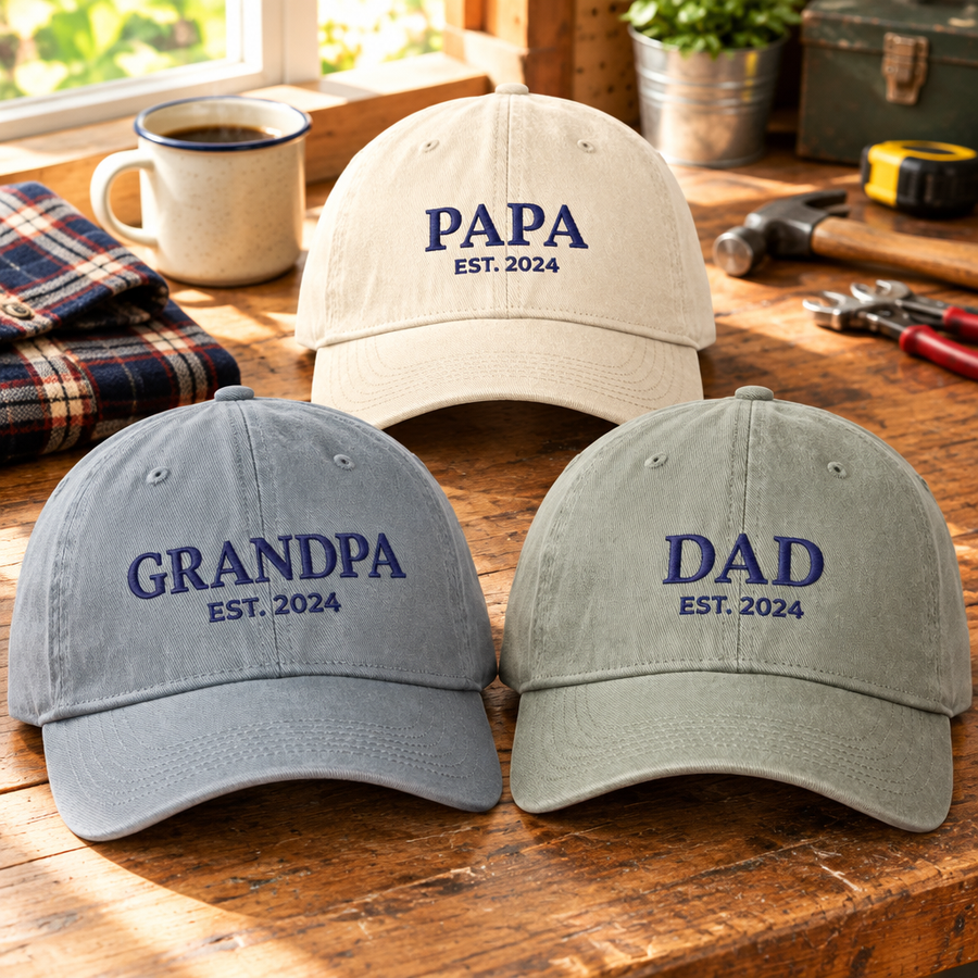 Custom embroidered Papa, Grandpa and Dad hats with EST year on a workbench