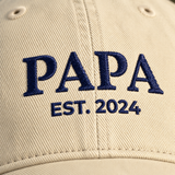 Close up of navy thread embroidery on the Papa hat