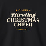 Close-up of the ICU Nurse Titrating Christmas Cheer print on a black crewneck