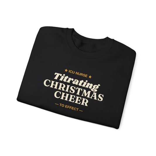 Black ICU Nurse Titrating Christmas Cheer sweatshirt folded to show the front print