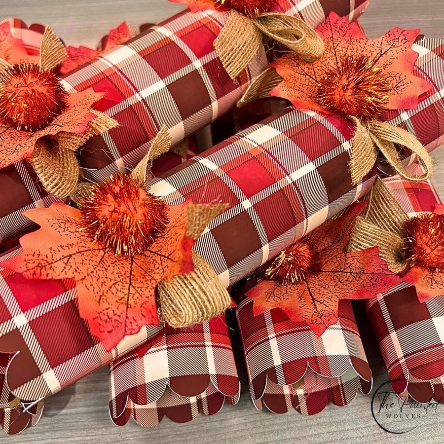Close view of the fall plaid paper with scalloped ends and a burlap ribbon