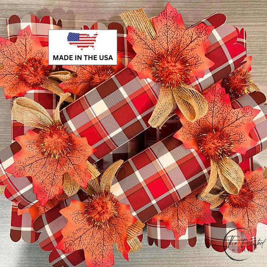 Fall plaid Thanksgiving crackers in red, white and brown with orange leaves and pom poms