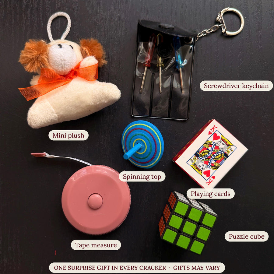 Gifts that may be inside the crackers, each labelled: mini plush, screwdriver keychain, spinning top, playing cards, tape measure and puzzle cube