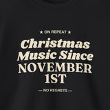 Close-up of the cream Christmas Music Since November 1st print on a black crewneck