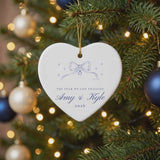 Personalized heart engagement ornament gently swaying on a lit Christmas tree