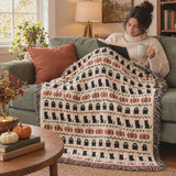 Short video of the Haunted Heirloom Fair Isle woven blanket draped over a sage sofa