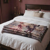 Short video of the Till Death Do Us Part pink skeleton woven blanket on a bed