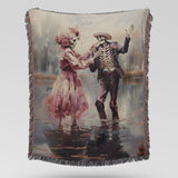 Video showing the pink skeleton couple woven blanket unfolding and draping