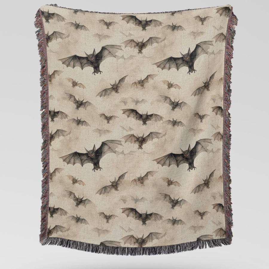 Video of the bat woven Halloween blanket being unfolded and draped