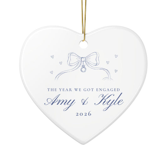 Personalized heart ornament with ribbon bow, sample text The Year We Got Engaged, Amy and Kyle, 2026