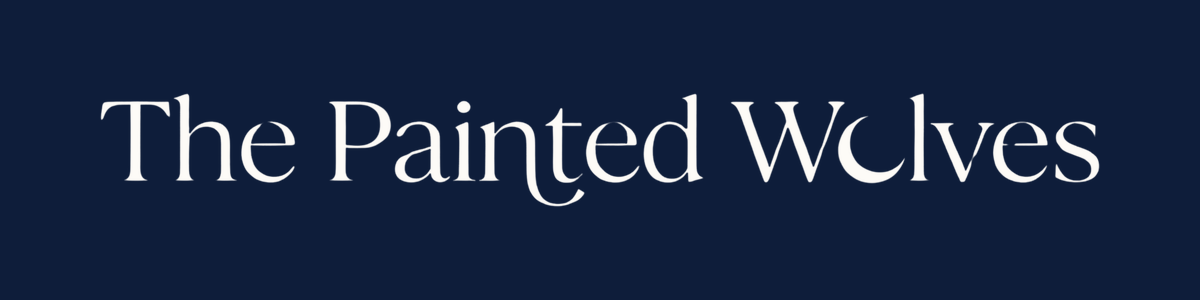 The Painted Wolves gift card, cream wordmark on deep navy