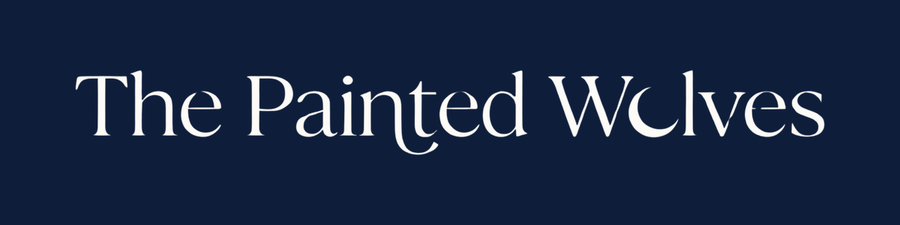 The Painted Wolves gift card, cream wordmark on deep navy