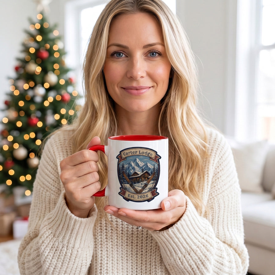 Woman holding personalized ski lodge mug by the Christmas tree