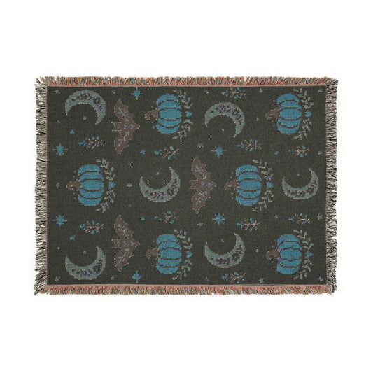 Back of the Subtle Spooky neutral Halloween woven blanket showing the reverse side of the weave
